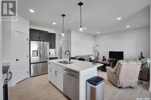 413 Germain Manor, Saskatoon, SK - Indoor Photo Showing Kitchen With Stainless Steel Kitchen With Double Sink With Upgraded Kitchen