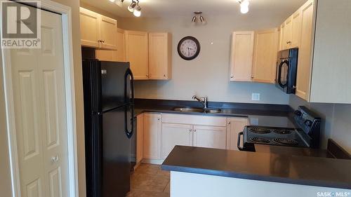 1 201 Carlyle Avenue, Carlyle, SK - Indoor Photo Showing Kitchen With Double Sink