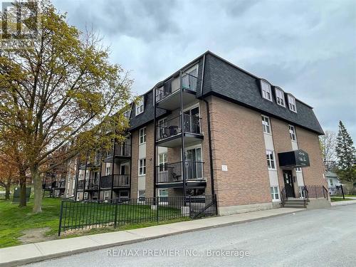 210 - 25 College Street E, Belleville, ON - Outdoor With Balcony With Facade