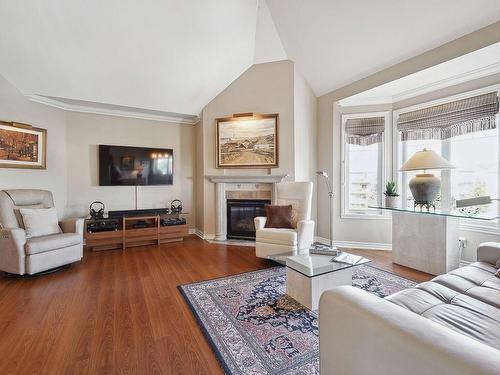 Salon - 403-291 Place Harel, Sainte-Thérèse, QC - Indoor Photo Showing Living Room With Fireplace