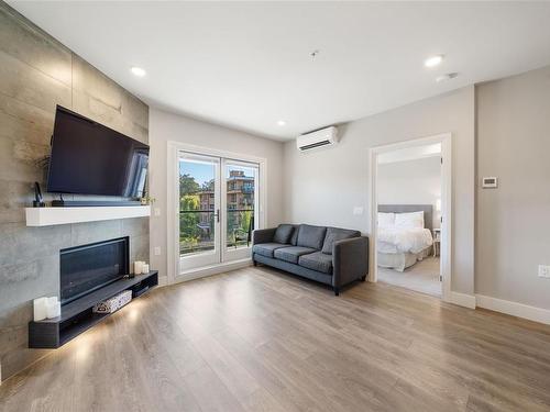 401-741 Travino Lane, Saanich, BC - Indoor Photo Showing Living Room With Fireplace