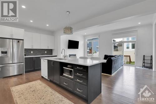 Tons of extra storage in the island. - 4527 Kelly Farm Drive, Ottawa, ON - Indoor Photo Showing Kitchen