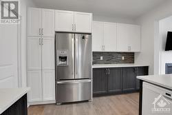 Modern appliances and handy pantry. - 