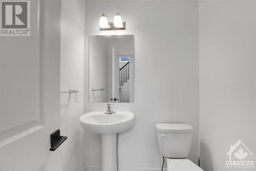 Main floor powder room. - 4527 Kelly Farm Drive, Ottawa, ON - Indoor Photo Showing Bathroom