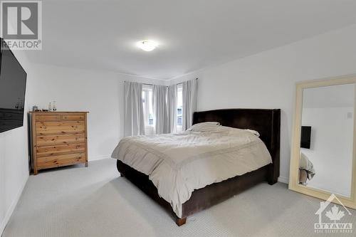 Luxurious master retreat offers a sumptuous 5pce ensuite, walk-in closet and these gorgeous corner windows. - 4527 Kelly Farm Drive, Ottawa, ON - Indoor Photo Showing Bedroom