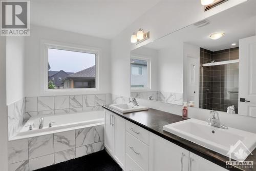 Beautiful tile work, counter top and double vanity. - 4527 Kelly Farm Drive, Ottawa, ON - Indoor Photo Showing Bathroom