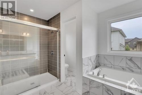 Glass-enclosed shower. - 4527 Kelly Farm Drive, Ottawa, ON - Indoor Photo Showing Bathroom