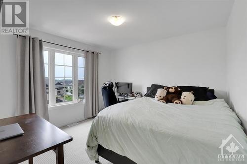 2nd bedroom with large window. - 4527 Kelly Farm Drive, Ottawa, ON - Indoor Photo Showing Bedroom