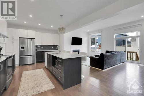 The open floor plan is perfect for entertaining. - 4527 Kelly Farm Drive, Ottawa, ON - Indoor Photo Showing Kitchen