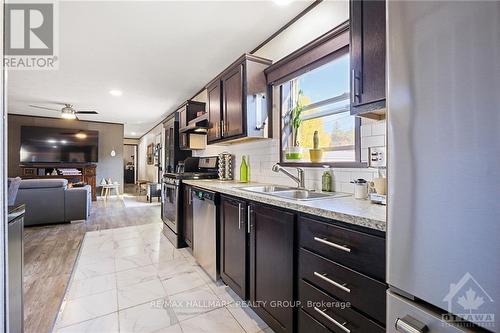 100 - 3535 St Joseph Boulevard, Ottawa, ON - Indoor Photo Showing Kitchen With Double Sink