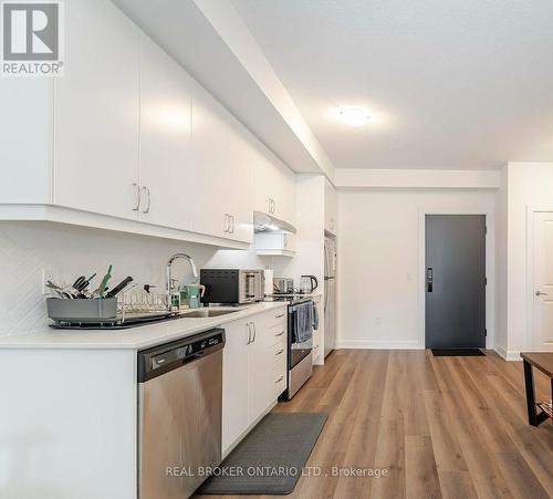 803 - 3200 William Coltson Avenue, Oakville, ON - Indoor Photo Showing Kitchen With Stainless Steel Kitchen