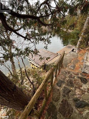 West facing patio - Beside 94 Pine Point Trail, Trent Lakes, ON - Outdoor With Body Of Water With View