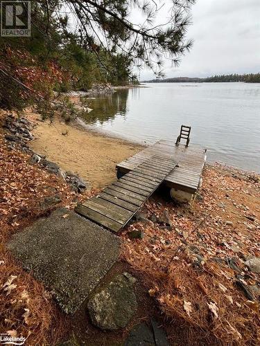 Sandy beach - Beside 94 Pine Point Trail, Trent Lakes, ON - Outdoor With Body Of Water With View