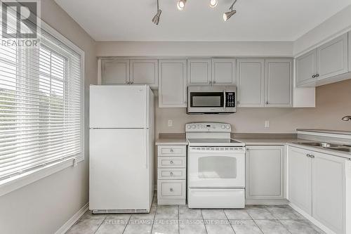 18 - 6810 Meadowvale Town Cent Circle, Mississauga, ON - Indoor Photo Showing Kitchen With Double Sink