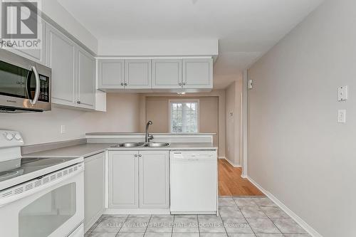 18 - 6810 Meadowvale Town Cent Circle, Mississauga, ON - Indoor Photo Showing Kitchen With Double Sink