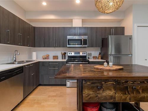 106-4050 Douglas St, Saanich, BC - Indoor Photo Showing Kitchen With Double Sink