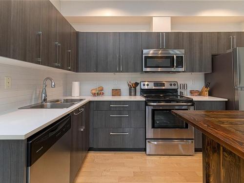 106-4050 Douglas St, Saanich, BC - Indoor Photo Showing Kitchen With Double Sink