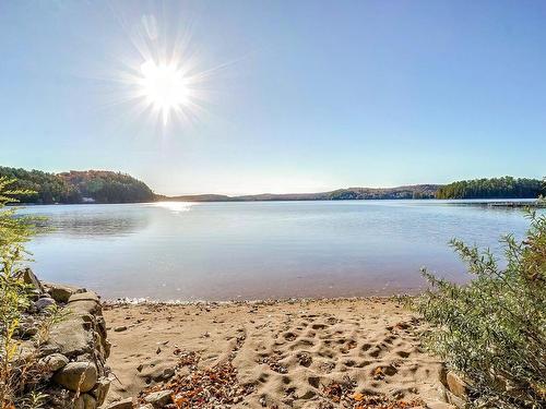 Back facade - 71 413E Avenue, Saint-Hippolyte, QC - Outdoor With Body Of Water