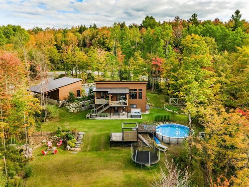 Back facade - 110 Rue Guillaume, Magog, QC - Outdoor With Above Ground Pool