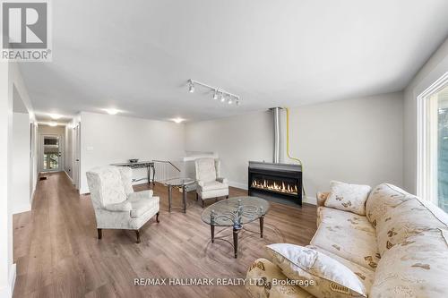 2422 Snow Valley Road, Springwater, ON - Indoor Photo Showing Living Room With Fireplace