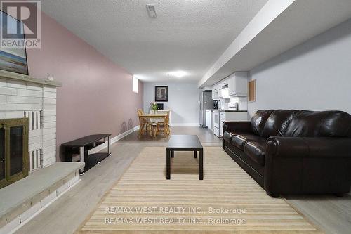 19 Radenhurst Crescent, Barrie, ON - Indoor Photo Showing Living Room With Fireplace