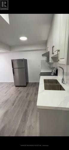 7 - 3 Simcoe Street S, Oshawa, ON - Indoor Photo Showing Kitchen With Double Sink