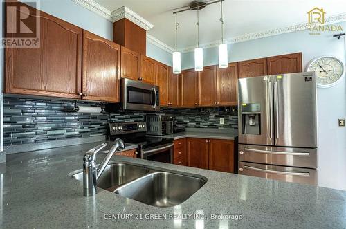 18 Fiddlehead Terrace, Toronto, ON - Indoor Photo Showing Kitchen With Double Sink