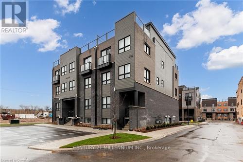 100 - 6705 Cropp Street, Niagara Falls, ON - Outdoor With Facade