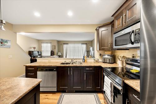 127-440 Hartman Road, Kelowna, BC - Indoor Photo Showing Kitchen With Stainless Steel Kitchen With Double Sink With Upgraded Kitchen