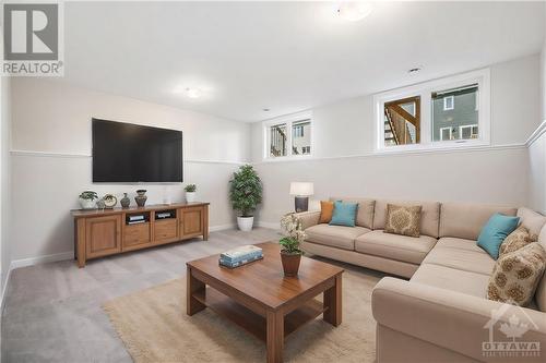 This photo has been virtually staged. - 24 Margaret Graham Terrace, Smiths Falls, ON - Indoor Photo Showing Living Room