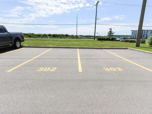 Parking - 303-12000 Rue D'Amboise, Mirabel, QC - Outdoor