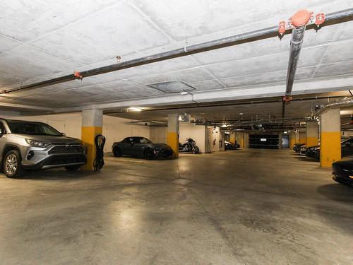 Garage - 303-12000 Rue D'Amboise, Mirabel, QC - Indoor Photo Showing Garage