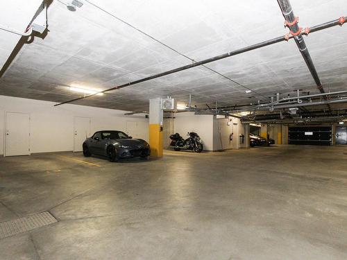 Garage - 302-12000 Rue D'Amboise, Mirabel, QC - Indoor Photo Showing Garage