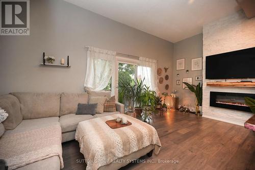 68 - 400 Bloor Street, Mississauga, ON - Indoor Photo Showing Living Room With Fireplace