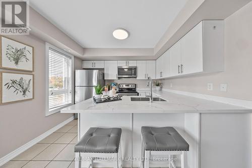 111 - 2 Dunsheath Way, Markham, ON - Indoor Photo Showing Kitchen With Stainless Steel Kitchen With Double Sink