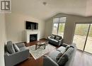 3217 Mosley Street, Wasaga Beach, ON  - Indoor Photo Showing Living Room With Fireplace 