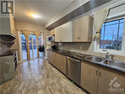 Kitchen with window for lots of natural light - 640 Via Campanale Avenue, Ottawa, ON - Indoor Photo Showing Kitchen With Double Sink