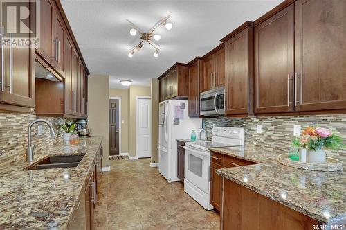 22 Elisia Drive, Moose Jaw, SK - Indoor Photo Showing Kitchen With Double Sink