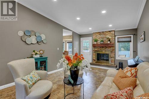 22 Elisia Drive, Moose Jaw, SK - Indoor Photo Showing Living Room With Fireplace