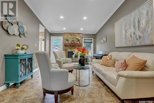 22 Elisia Drive, Moose Jaw, SK - Indoor Photo Showing Living Room With Fireplace