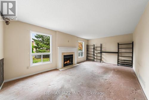 4 Riverwood Street, Whitby (Pringle Creek), ON - Indoor Photo Showing Living Room With Fireplace