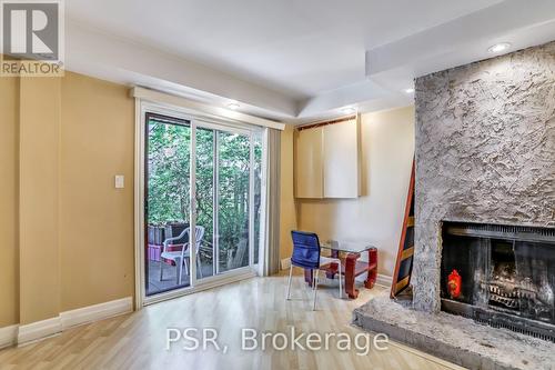 64 - 6780 Formentera Avenue, Mississauga, ON - Indoor Photo Showing Living Room With Fireplace