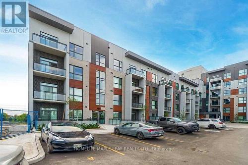 429 - 95 Dundas Street E, Oakville, ON - Outdoor With Facade