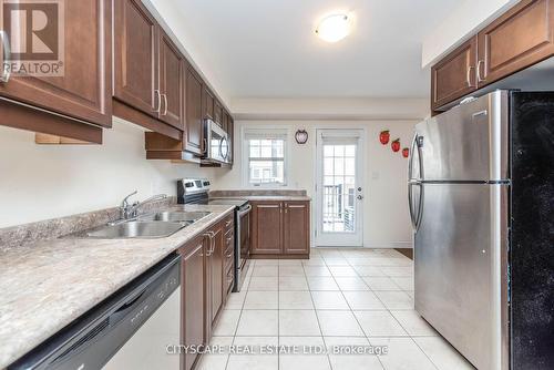 85 - 1000 Asleton Boulevard, Milton, ON - Indoor Photo Showing Kitchen With Double Sink