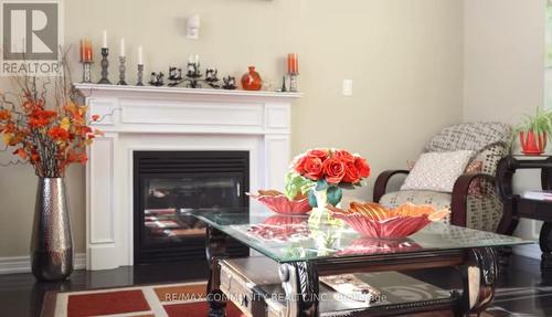 63 Buxton Lane, Clarington, ON - Indoor Photo Showing Living Room With Fireplace