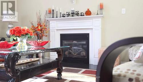 63 Buxton Lane, Clarington, ON - Indoor Photo Showing Living Room With Fireplace