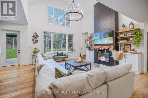 1025 Davis Drive, Gravenhurst, ON - Indoor Photo Showing Living Room With Fireplace