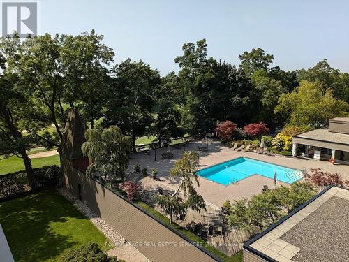 608 - 1400 Dixie Road, Mississauga, ON - Outdoor With In Ground Pool With Backyard