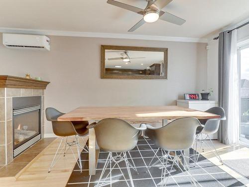 Dining room - 7440 Rue Angèle, Laval (Duvernay), QC - Indoor Photo Showing Dining Room With Fireplace