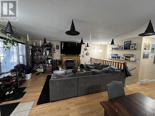 4403 Heritage Crescent, Fort Nelson, BC - Indoor Photo Showing Other Room With Fireplace